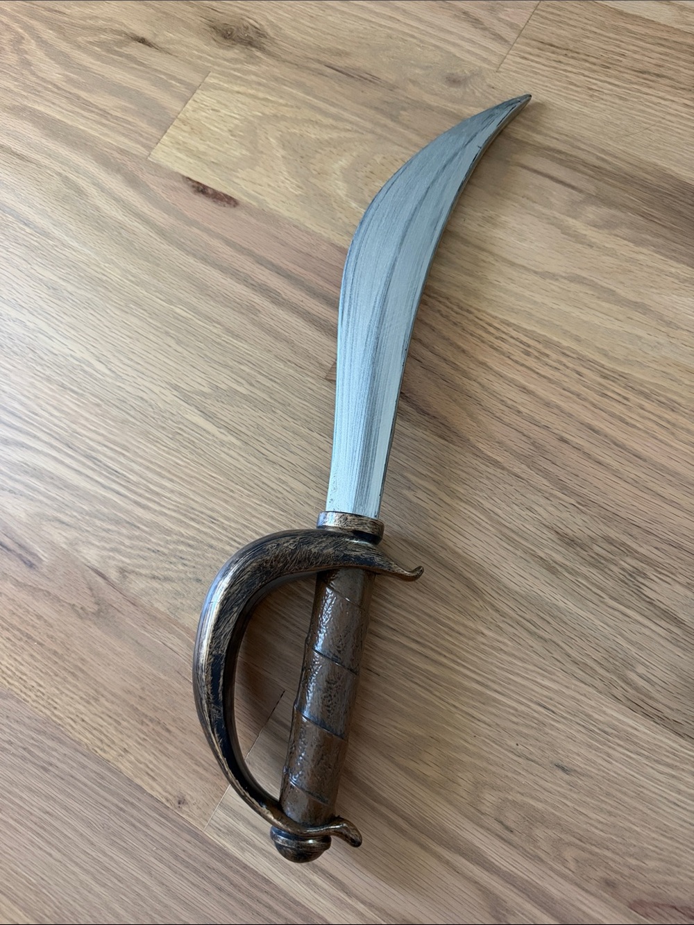 Plastic Decorative Curved Blade Sword with Brown Handle
